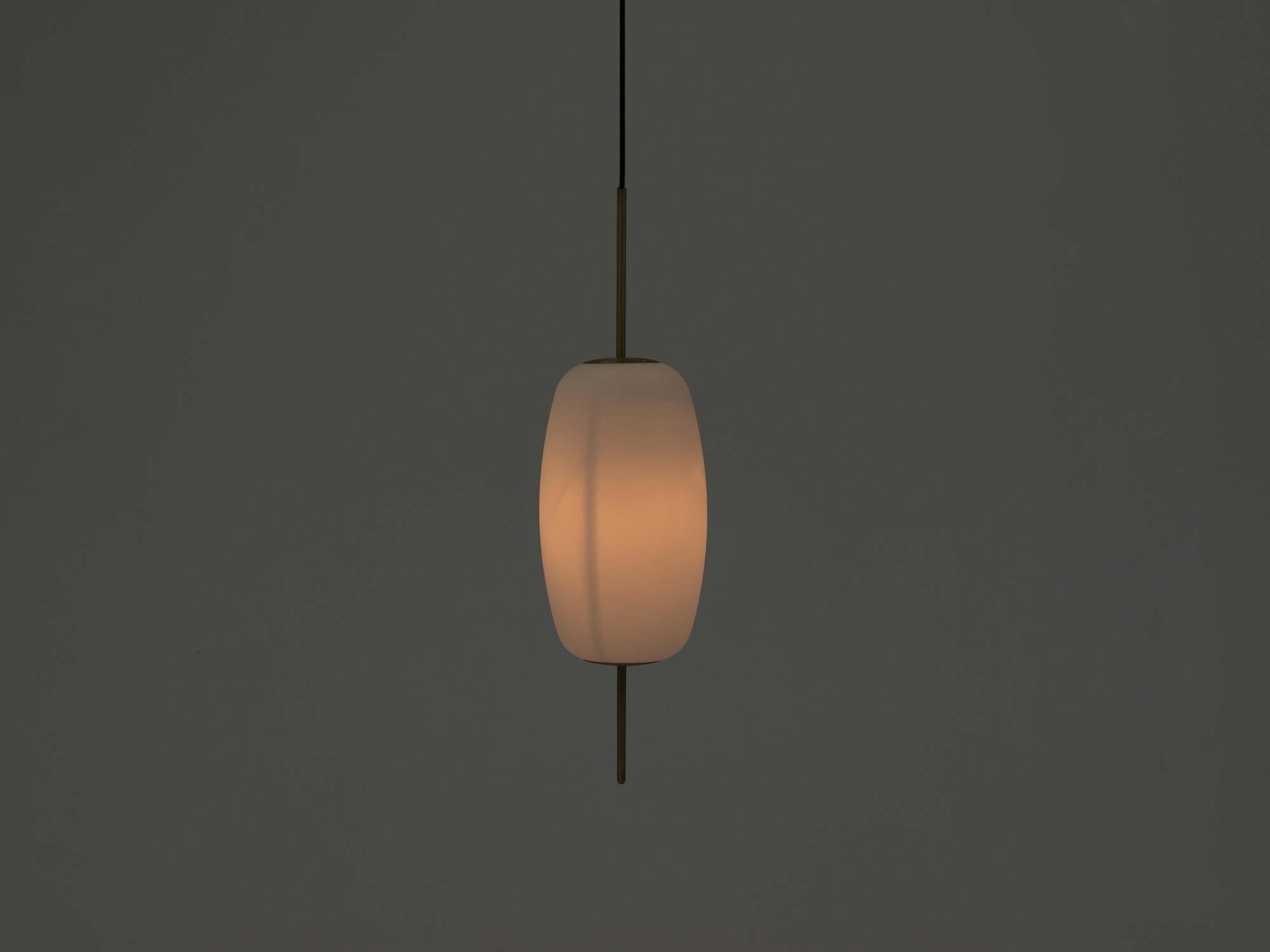 The large brass Silk kitchen pendant lamp with light on